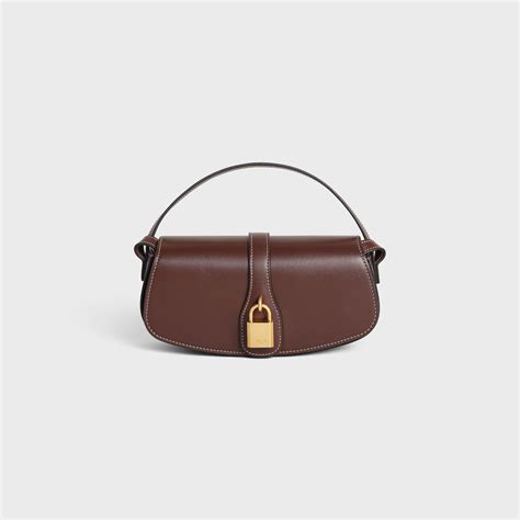 clutch on strap tabou in smooth calfskin